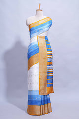 White and blue Dola Silk Saree with rich zari border woven butis and a designer pallu along with contrast blouse