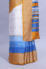 White and blue Dola Silk Saree with rich zari border woven butis and a designer pallu along with contrast blouse