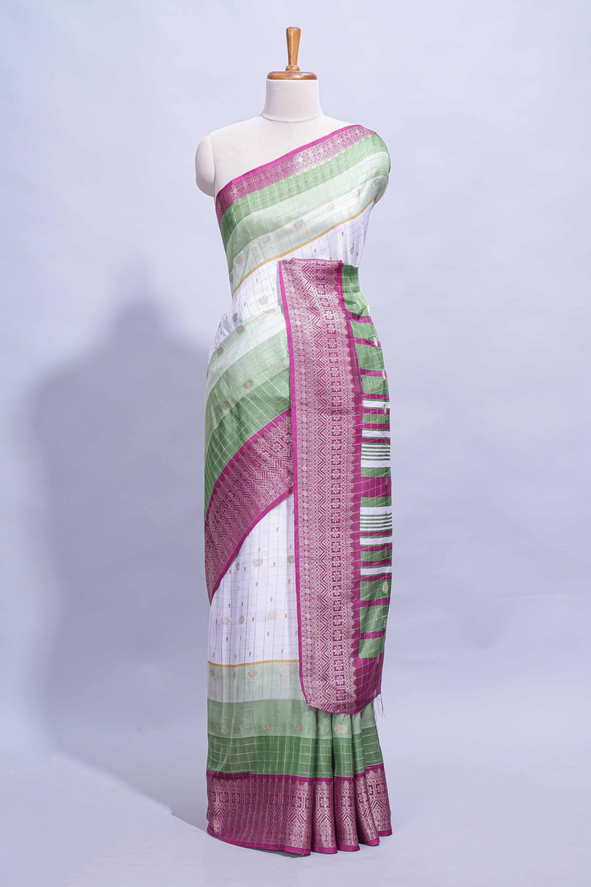 White and green Dola Silk Saree with rich zari border woven butis and a designer pallu along with contrast blouse