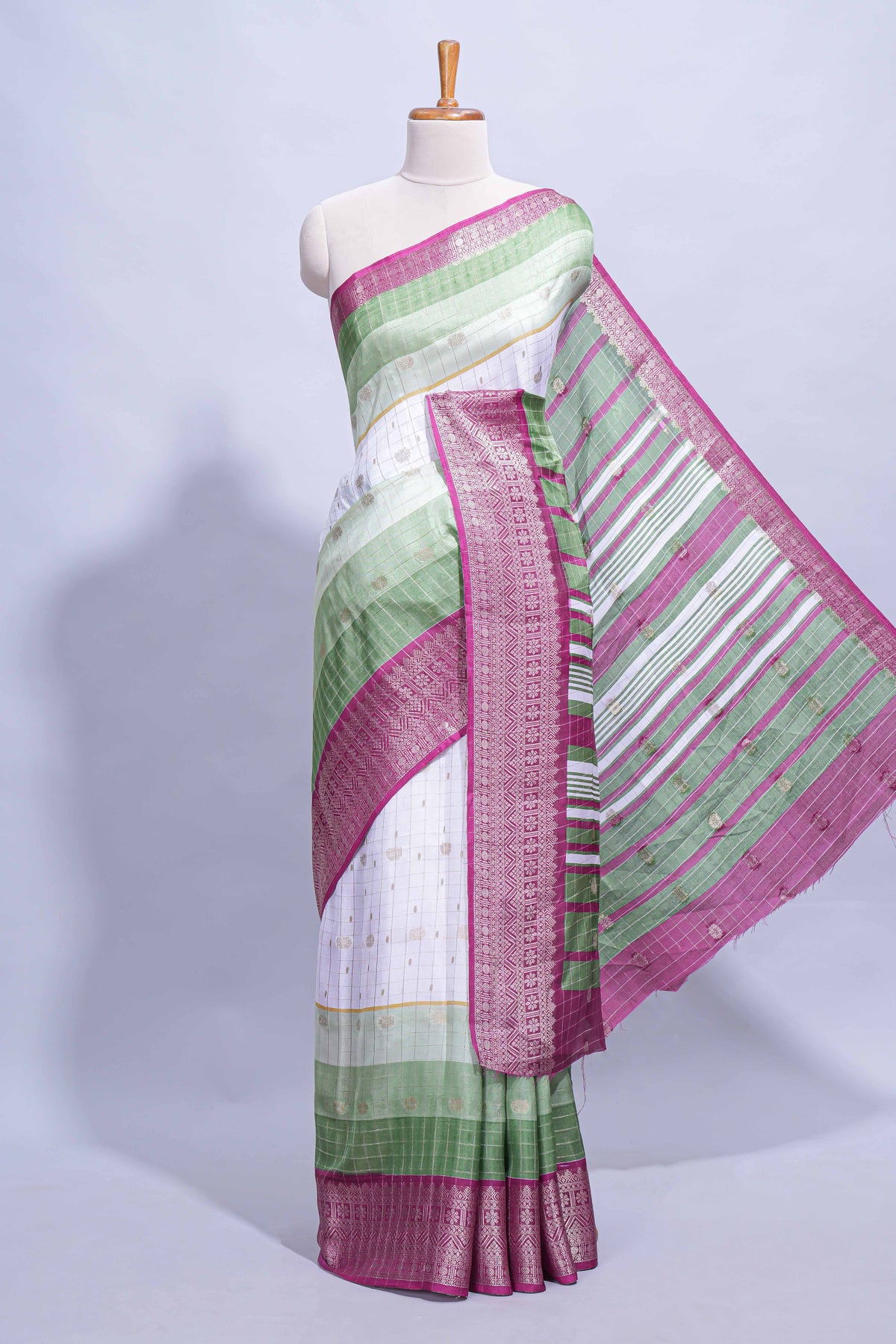 White and green Dola Silk Saree with rich zari border woven butis and a designer pallu along with contrast blouse
