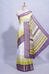 White and yellow Dola Silk Saree with rich zari border woven butis and a designer pallu along with contrast blouse