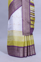 White and yellow Dola Silk Saree with rich zari border woven butis and a designer pallu along with contrast blouse