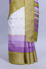 White and purple Dola Silk Saree with rich zari border woven butis and a designer pallu along with contrast blouse