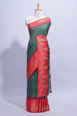 Dark Green Dola Silk Saree with elegant zari butis a rich zari border woven designer pallu along with matcing blouse