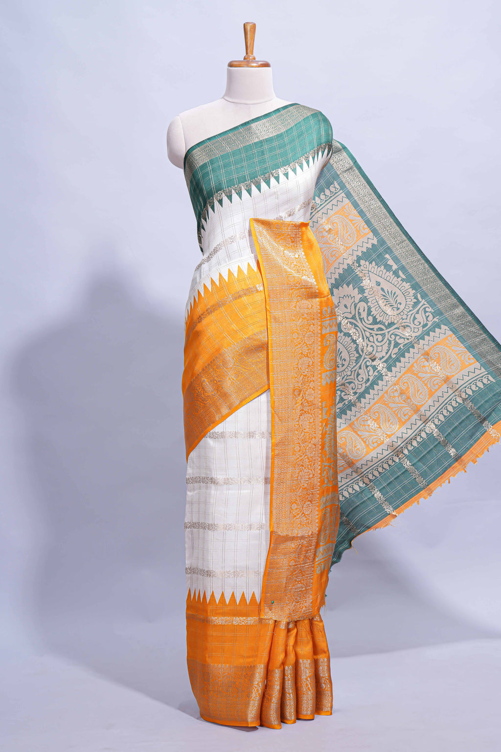 White Dola Silk Saree with orange and green zari borders elegant woven checks and a rich designer pallu along with contrast blouse