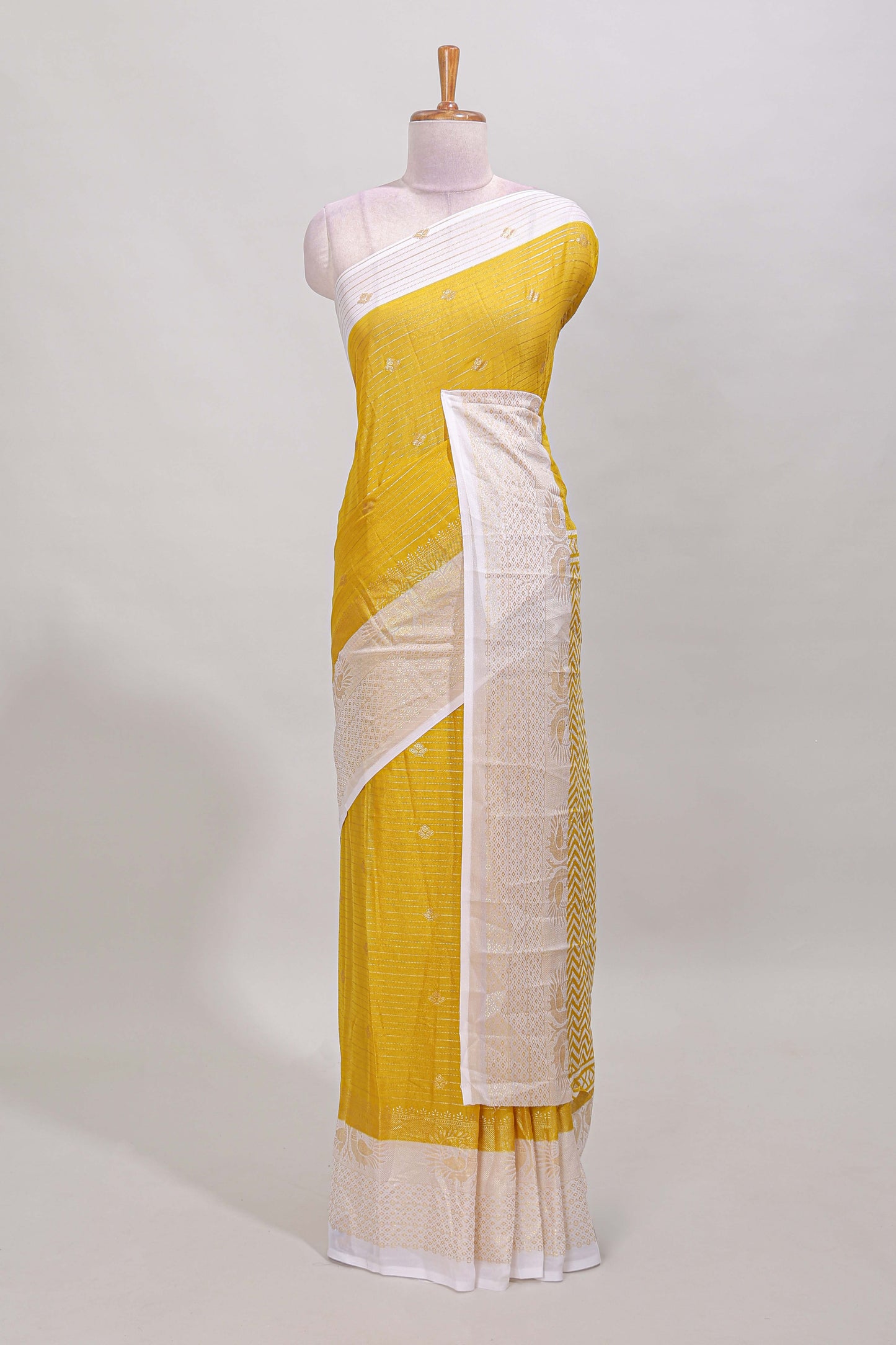 Yellow striped zari butta dola silk saree with contrast zari border and matching blouse