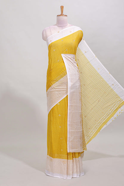 Yellow striped zari butta dola silk saree with contrast zari border and matching blouse
