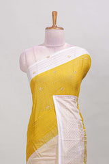 Yellow striped zari butta dola silk saree with contrast zari border and matching blouse