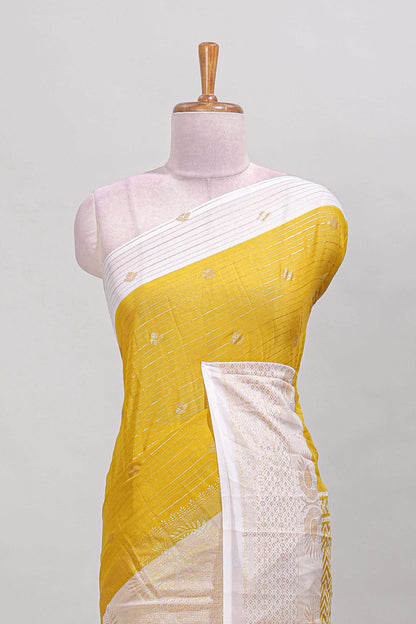 Yellow striped zari butta dola silk saree with contrast zari border and matching blouse