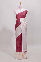 Maroon zari striped dola silk saree with contrast zari border and blouse