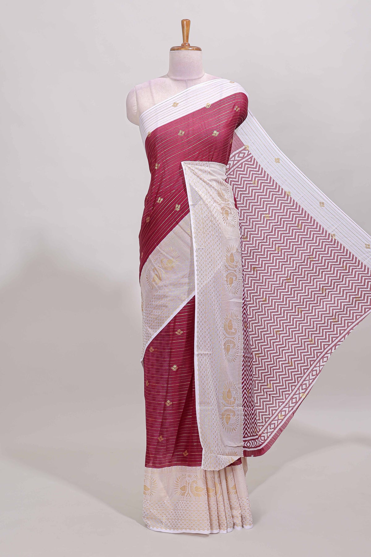 Maroon zari striped dola silk saree with contrast zari border and blouse