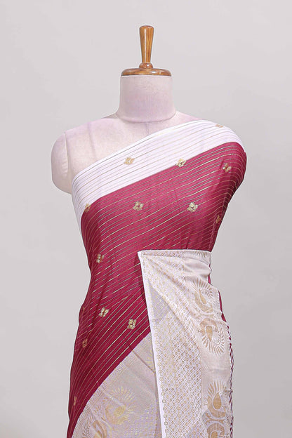 Maroon zari striped dola silk saree with contrast zari border and blouse
