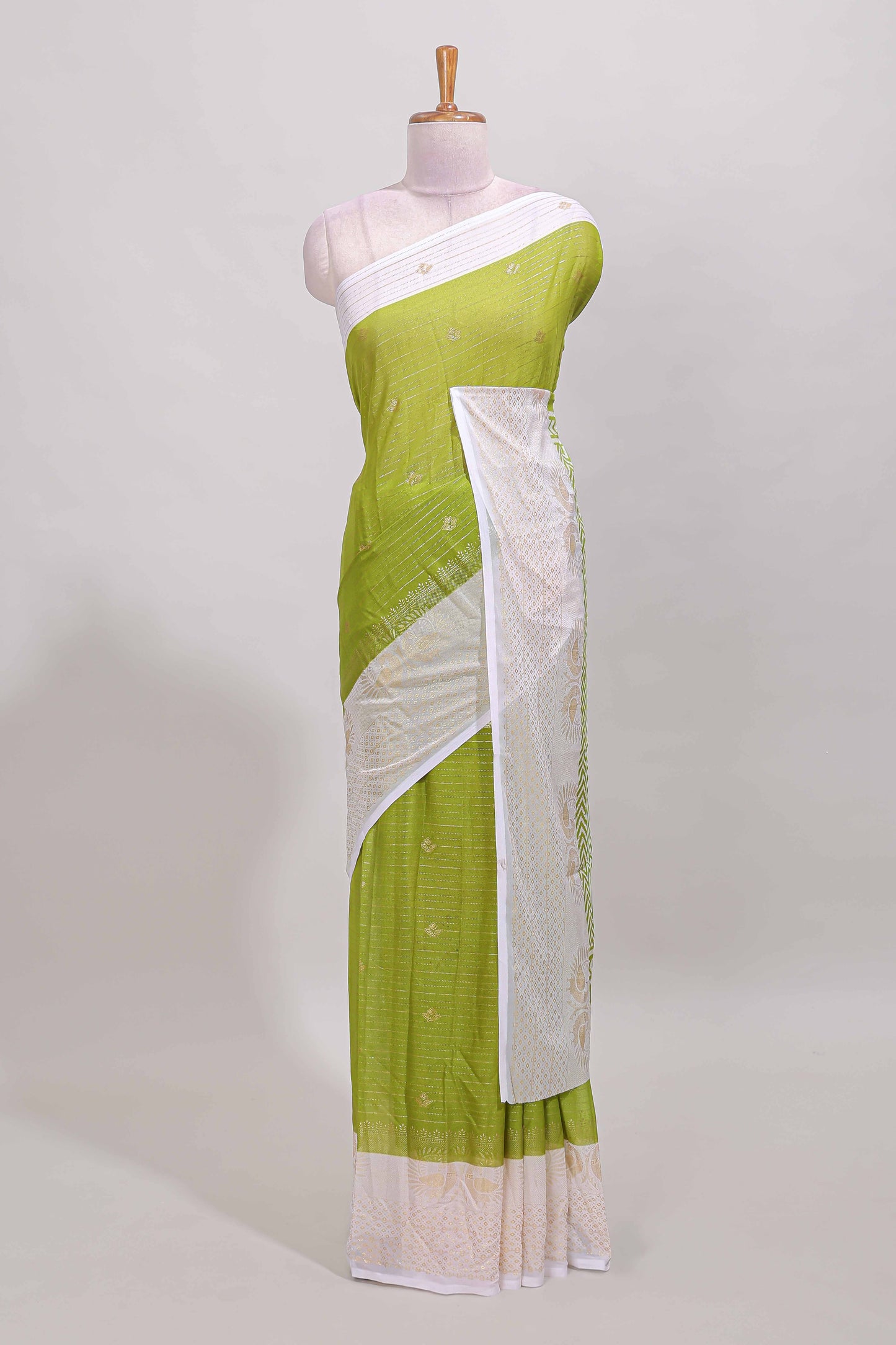 Green zari striped dola silk saree with contrast zari border and blouse