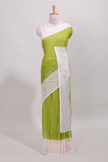 Green zari striped dola silk saree with contrast zari border and blouse