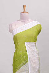 Green zari striped dola silk saree with contrast zari border and blouse