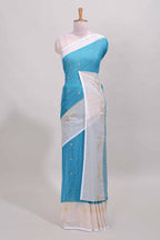Ice blue zari striped dola silk saree with contrast zari border and blouse