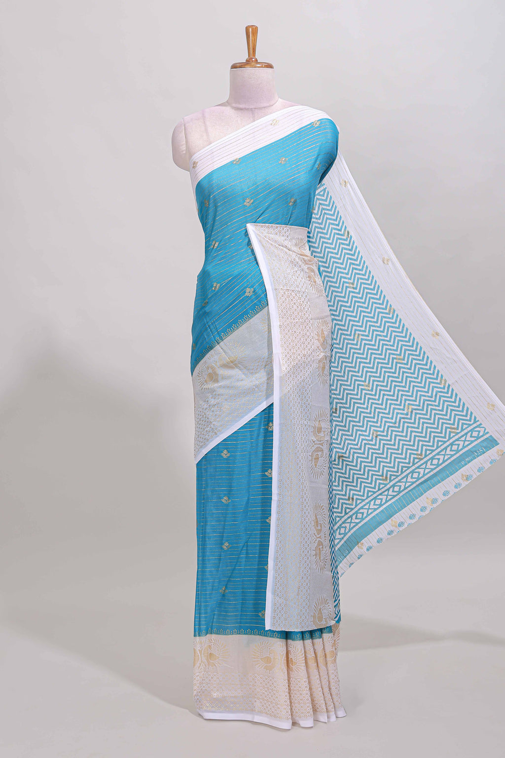 Ice blue zari striped dola silk saree with contrast zari border and blouse