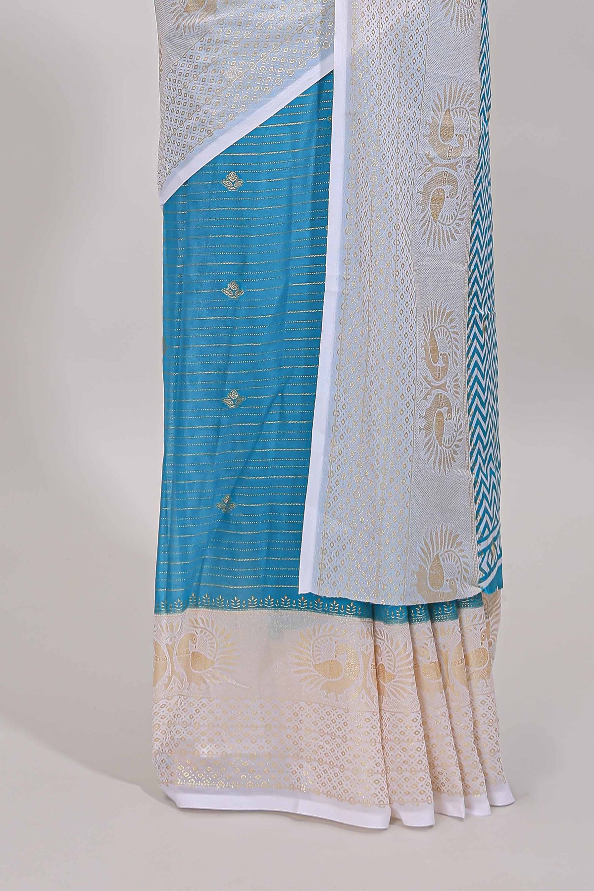 Ice blue zari striped dola silk saree with contrast zari border and blouse