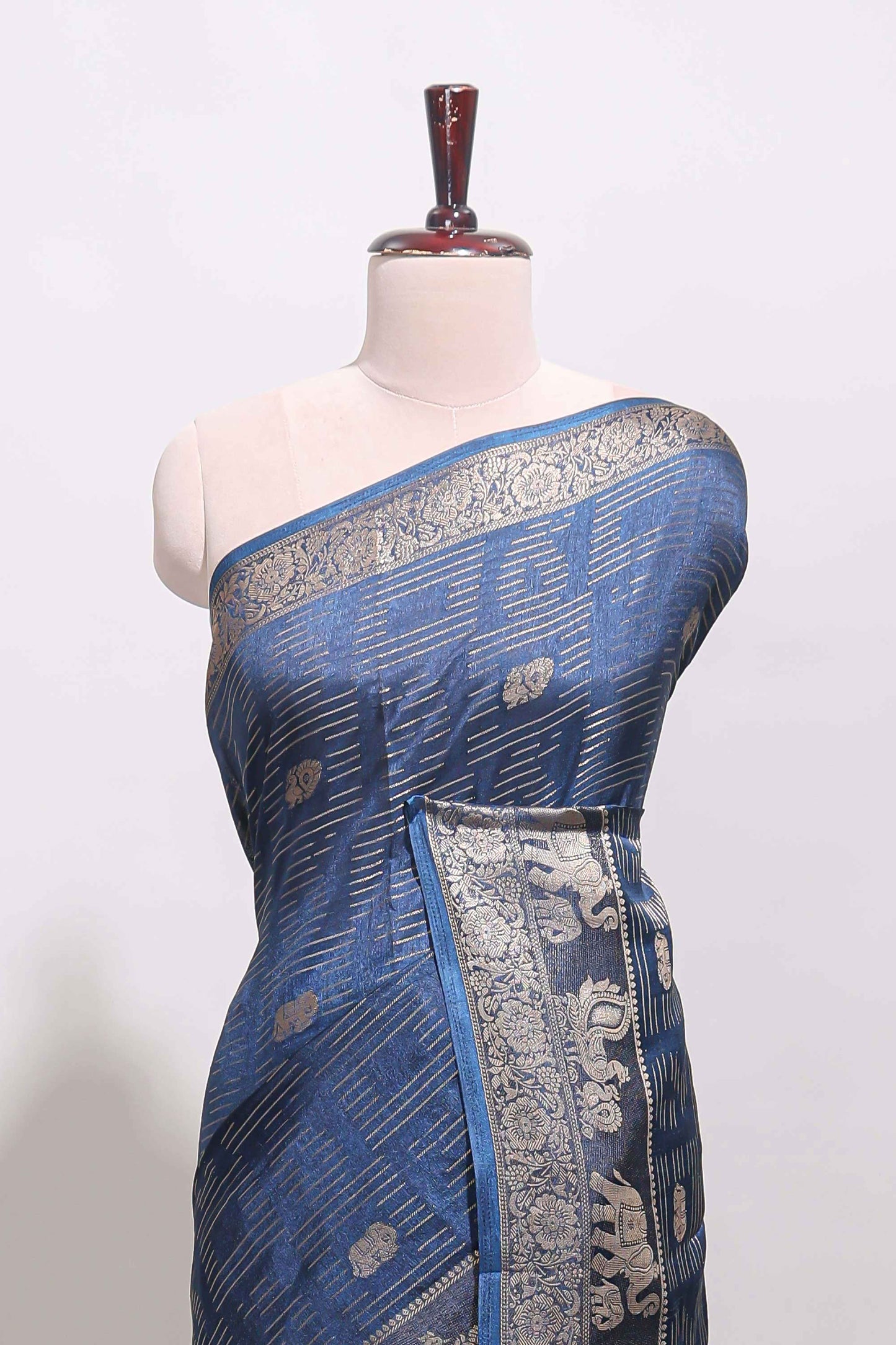 Midnight blue zari butta dola silk saree with self zari border and printed pallu