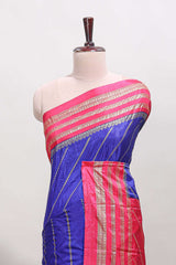 Blue zari striped saree in dola silk with contrast woven border and blouse