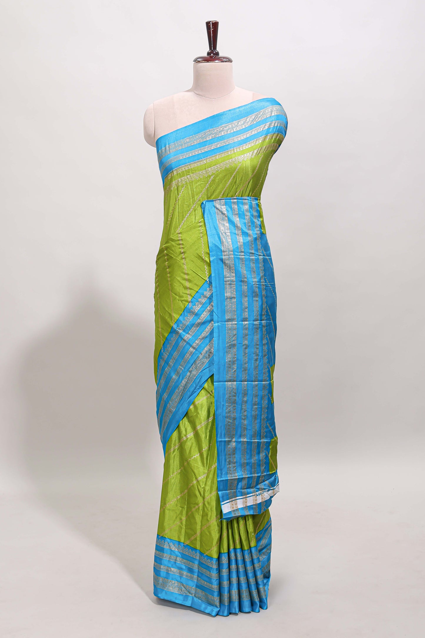 Lime green zari striped saree in dola silk with contrast woven border and blouse