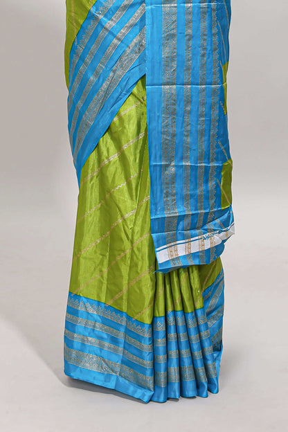 Lime green zari striped saree in dola silk with contrast woven border and blouse