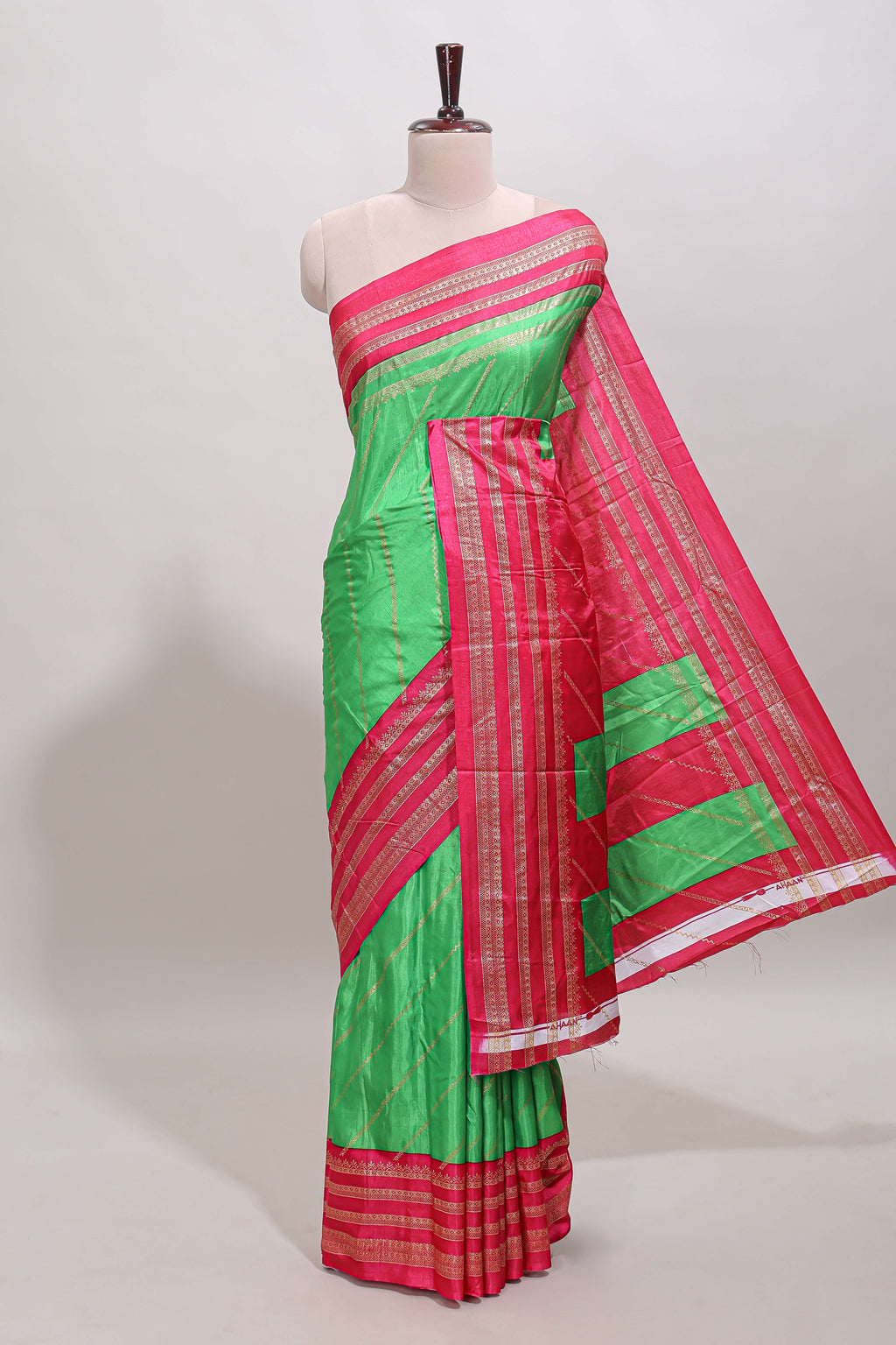 Neon green zari striped saree in dola silk with contrast woven border and blouse