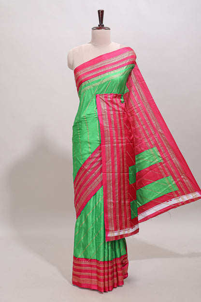 Neon green zari striped saree in dola silk with contrast woven border and blouse