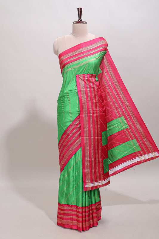 Neon green zari striped saree in dola silk with contrast woven border and blouse