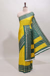 Yellow zari striped saree in dola silk with contrast woven border and blouse