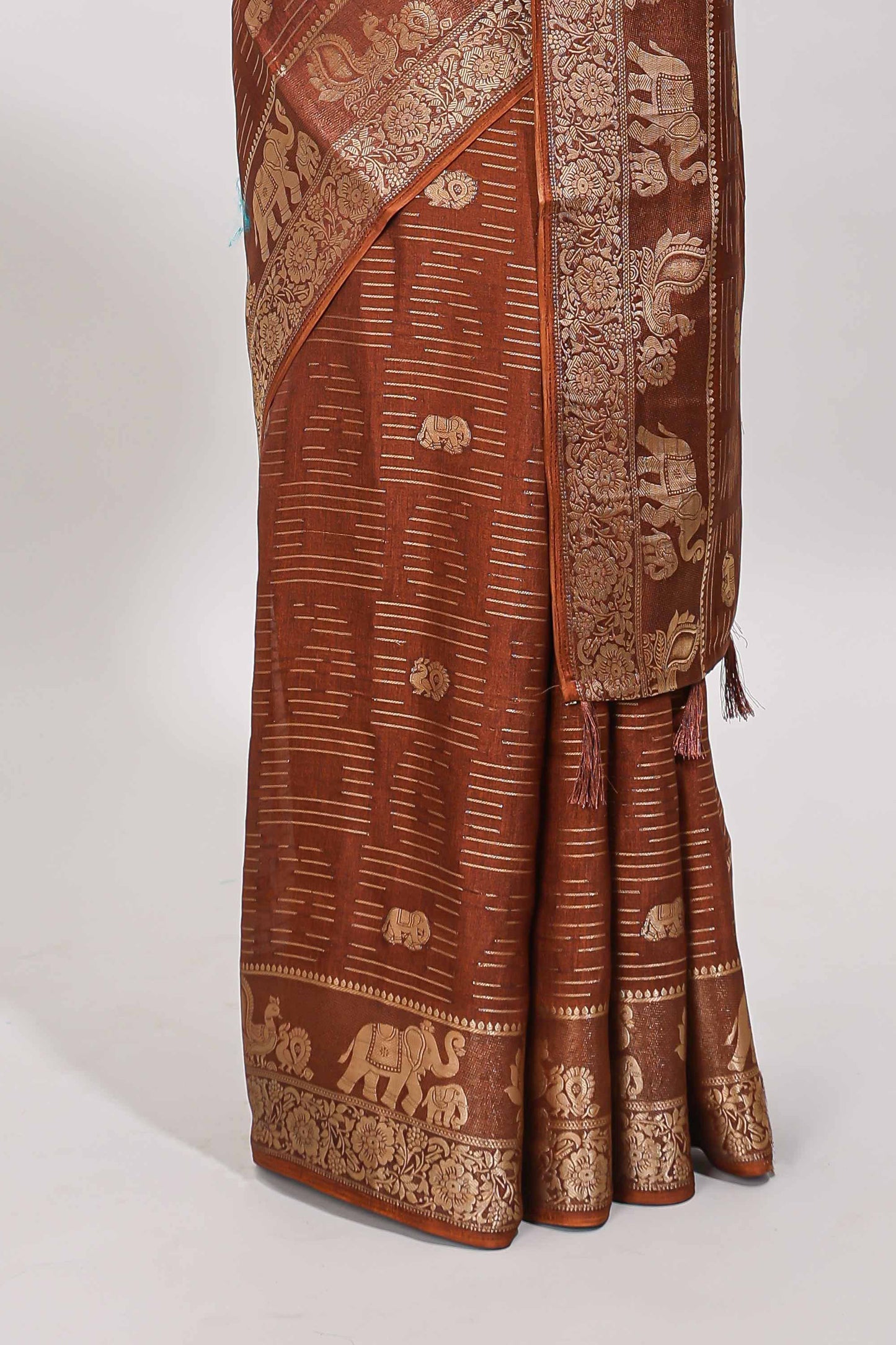 Brown zari butta dola silk saree with self zari border and printed pallu