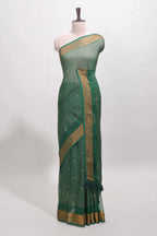 Green checked zari butta dola silk saree with self zari border and matching blouse