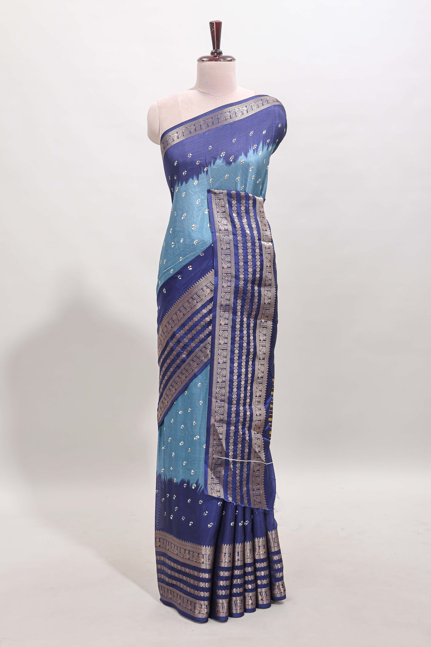 Turquoise blue unique buttas dola silk saree with contrast zari border and blouse