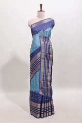 Turquoise blue unique buttas dola silk saree with contrast zari border and blouse