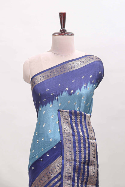 Turquoise blue unique buttas dola silk saree with contrast zari border and blouse