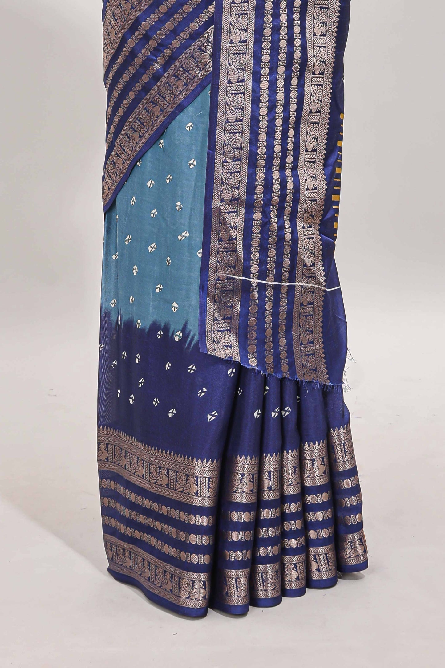 Turquoise blue unique buttas dola silk saree with contrast zari border and blouse