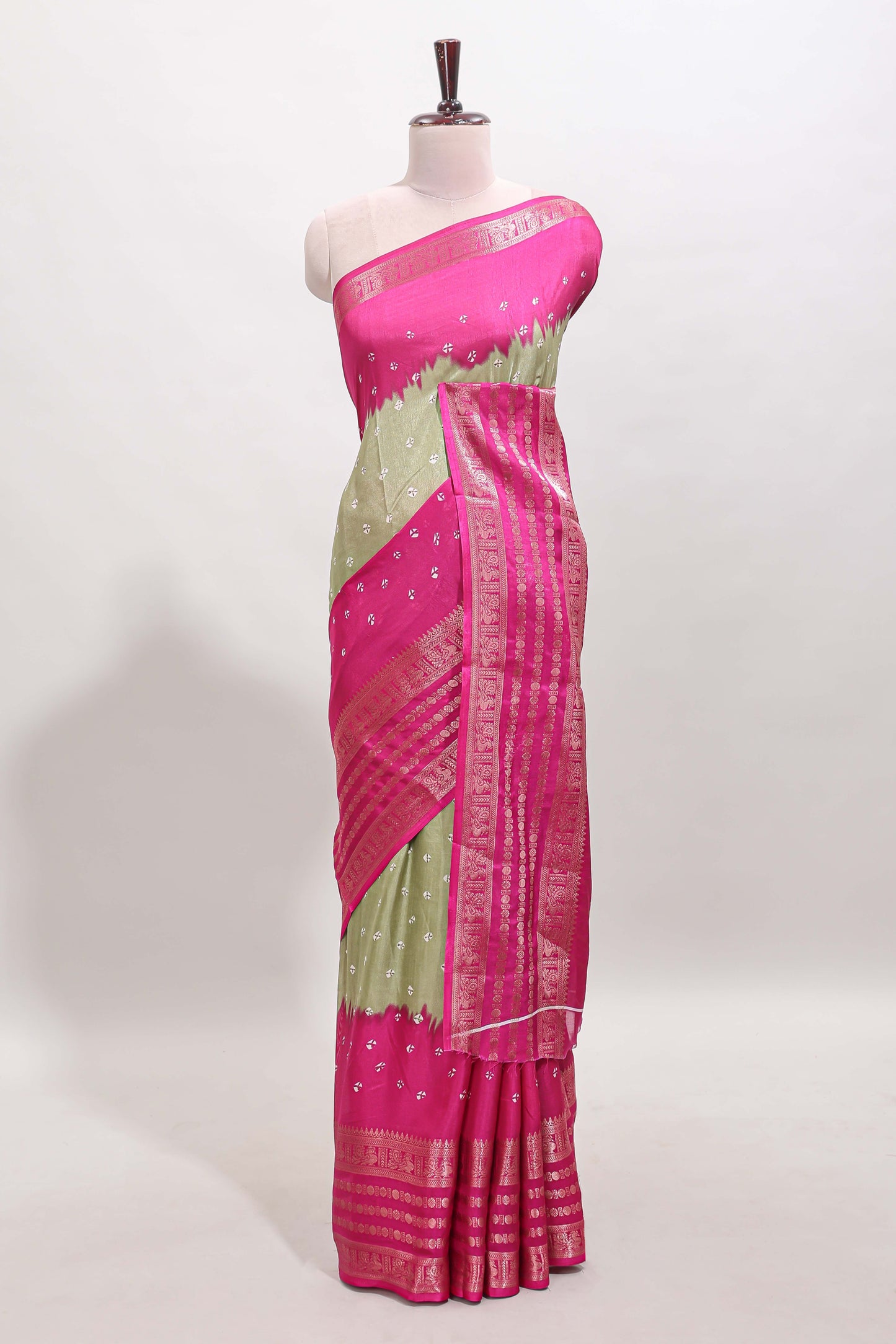 Green unique buttas dola silk saree with contrast zari border and blouse