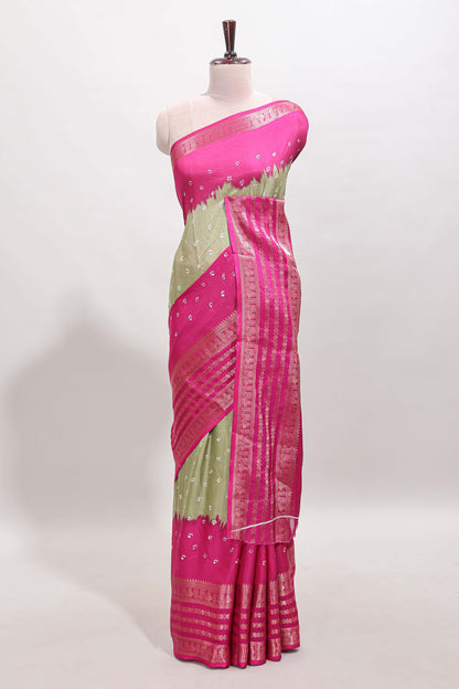Green unique buttas dola silk saree with contrast zari border and blouse