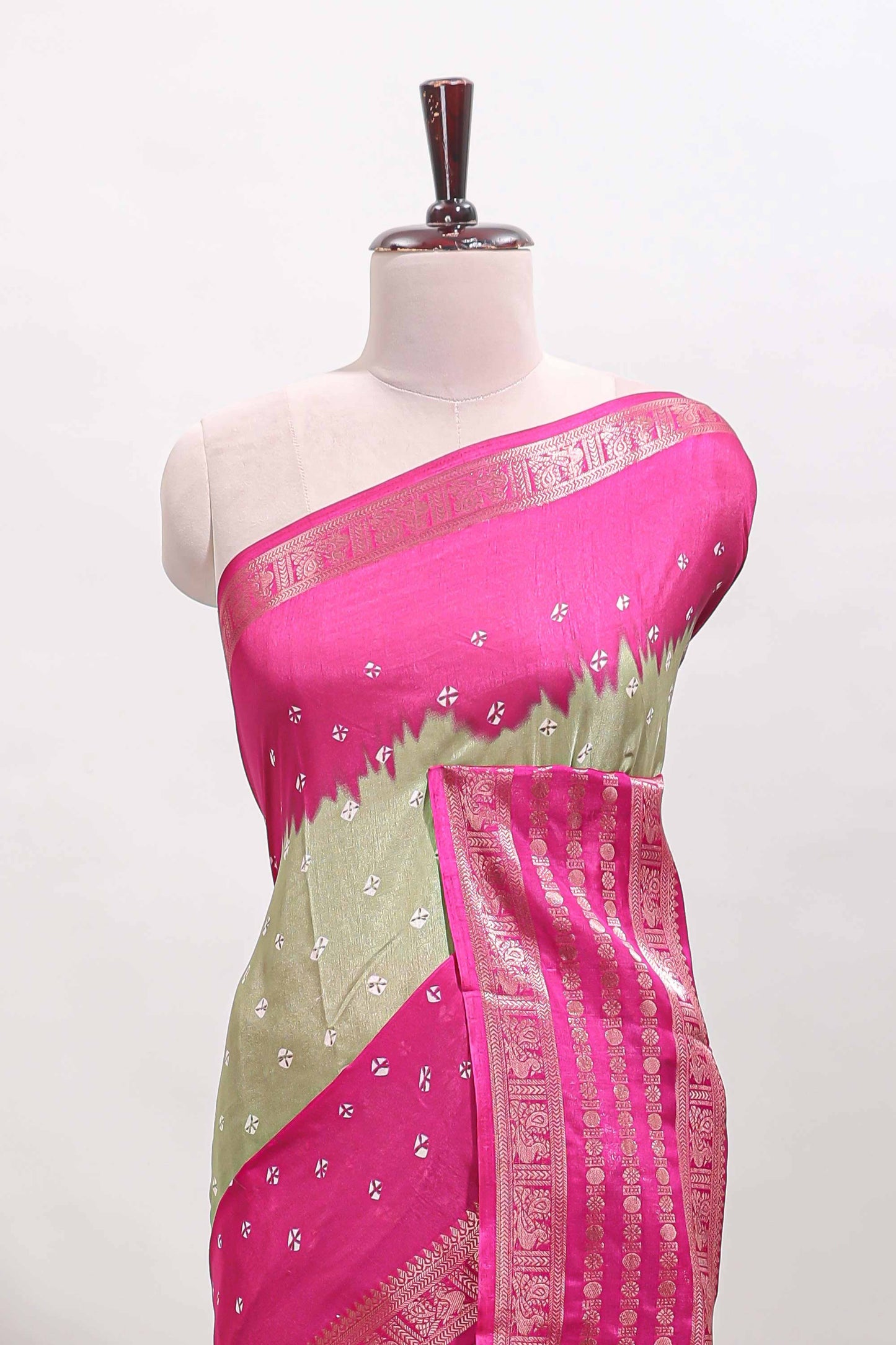 Green unique buttas dola silk saree with contrast zari border and blouse