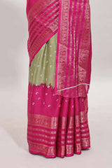 Green unique buttas dola silk saree with contrast zari border and blouse