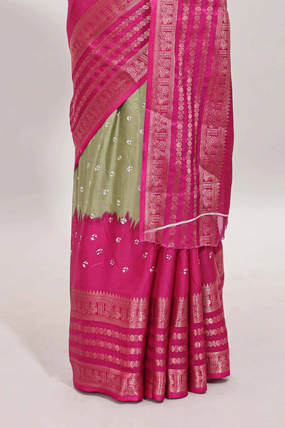 Green unique buttas dola silk saree with contrast zari border and blouse