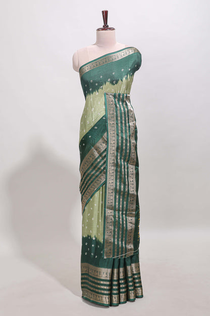 Green unique buttas dola silk saree with contrast dark green zari border and blouse