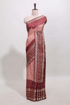 Pink unique buttas dola silk saree with contrast dark green zari border and blouse