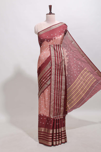 Pink unique buttas dola silk saree with contrast dark green zari border and blouse