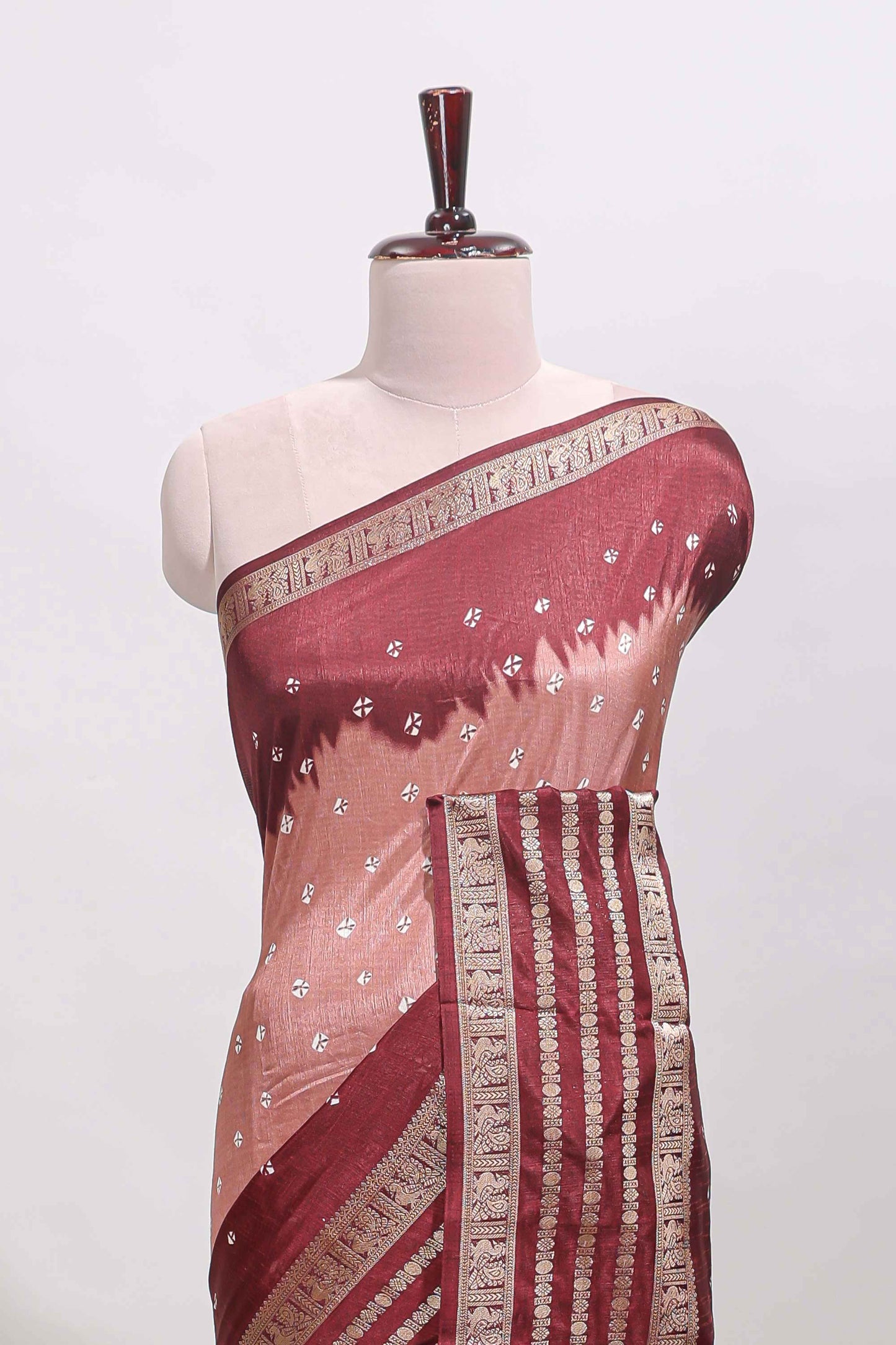 Pink unique buttas dola silk saree with contrast dark green zari border and blouse