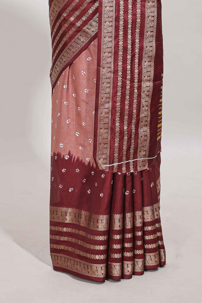 Pink unique buttas dola silk saree with contrast dark green zari border and blouse