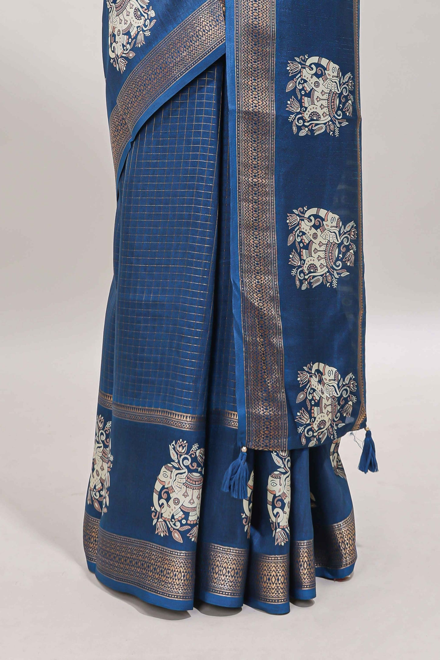 Blue checked elephant motifs dola silk saree with self zari border and striped pallu