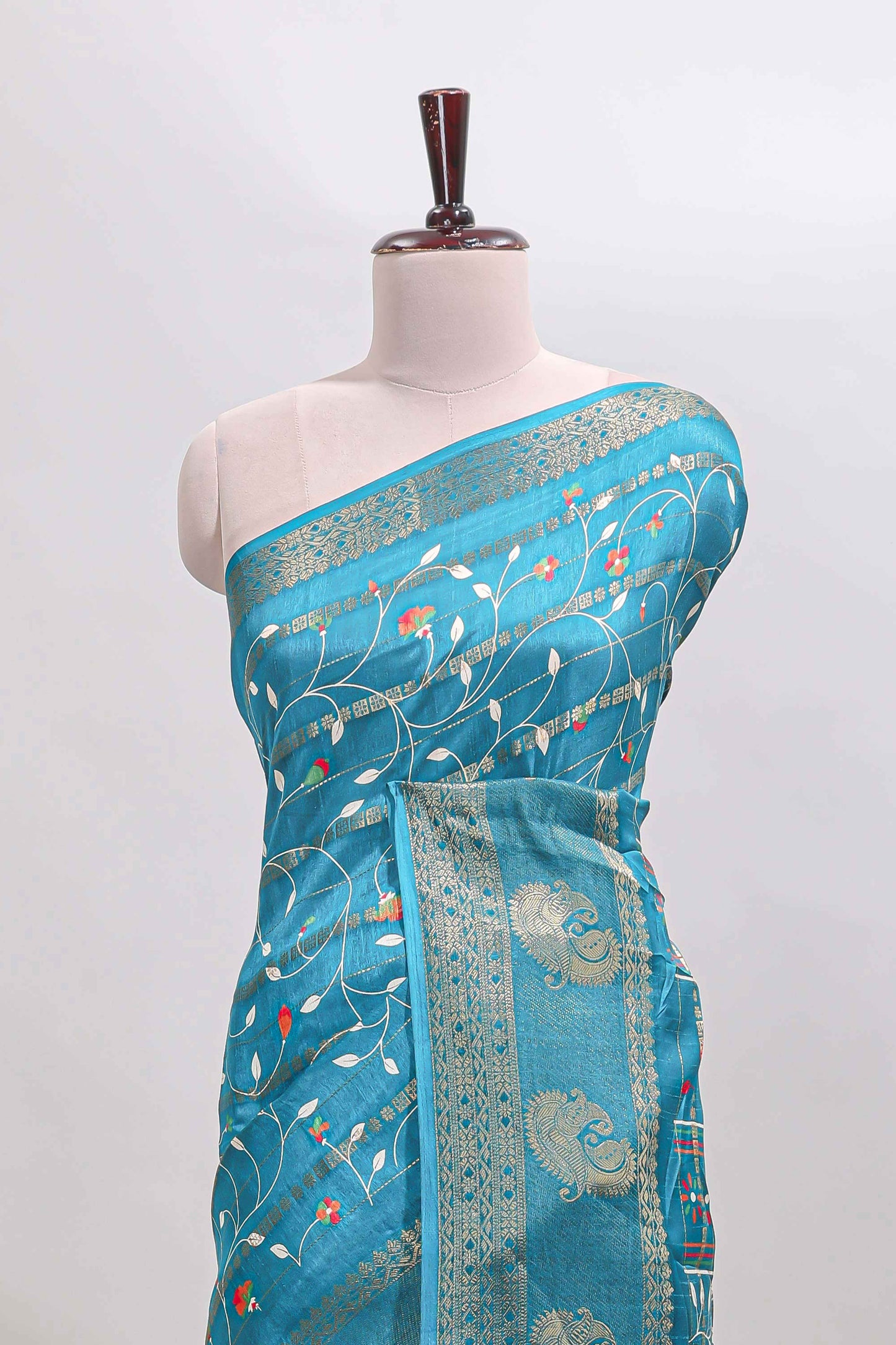 Midnight green zari striped floral vine design dola silk saree with self border and matching blouse