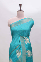 Turquoise green checked elephant motifs dola silk saree with self zari border and striped pallu