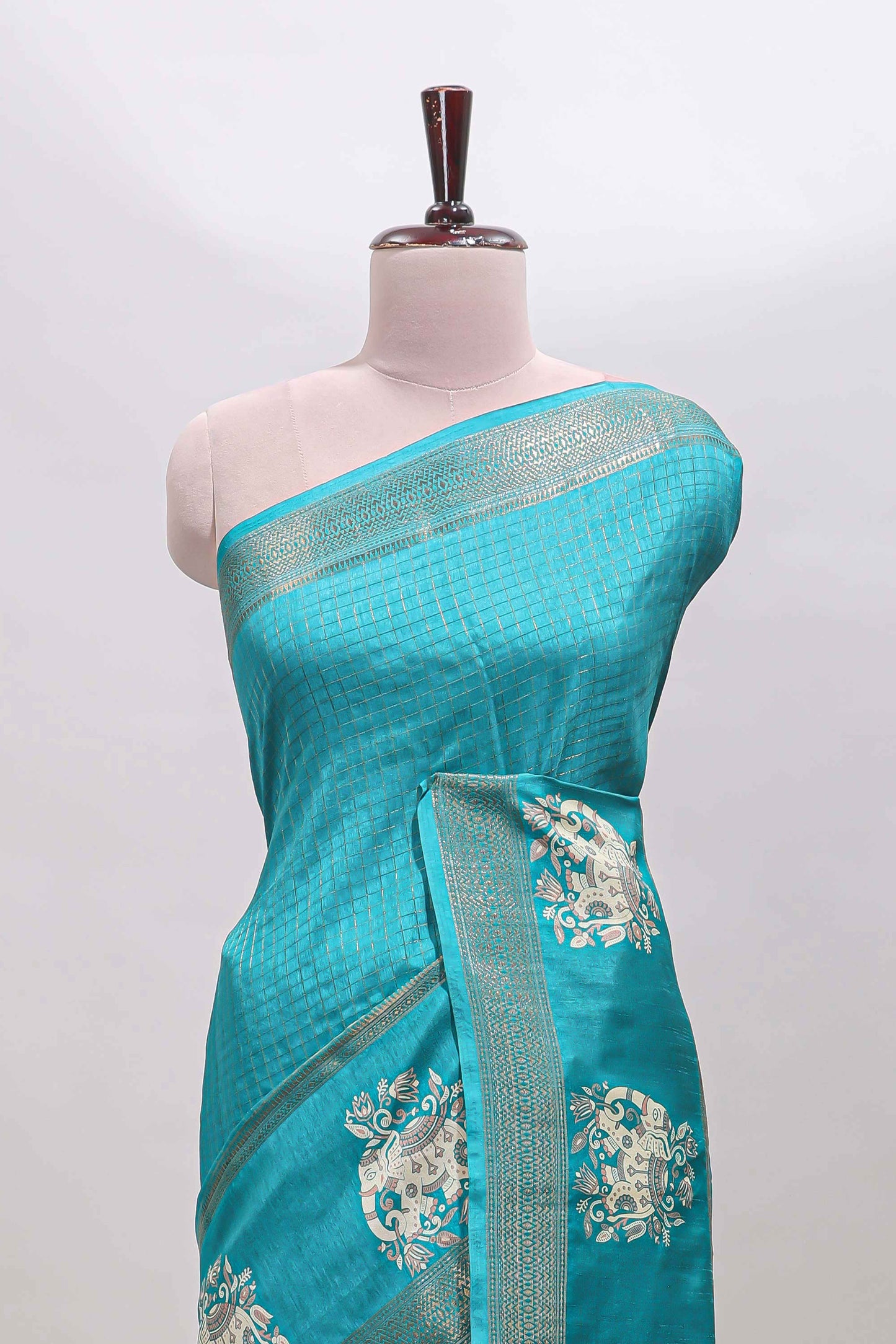 Turquoise green checked elephant motifs dola silk saree with self zari border and striped pallu